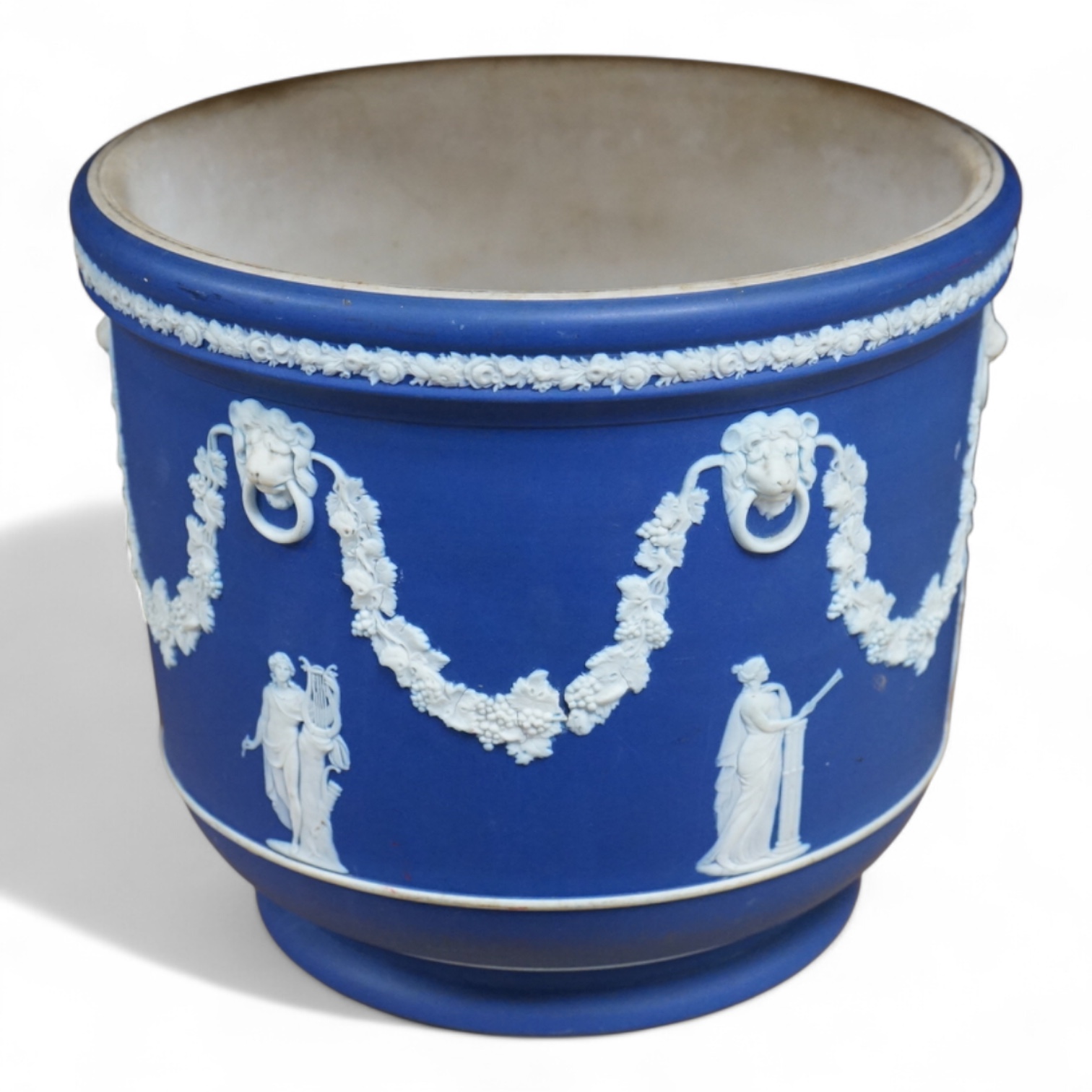 A Wedgwood jasperware jardiniere, 21cm high. Condition - poor